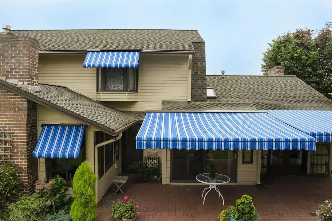 Decorative window awnings installation providing shade and curb appeal to New Jersey home