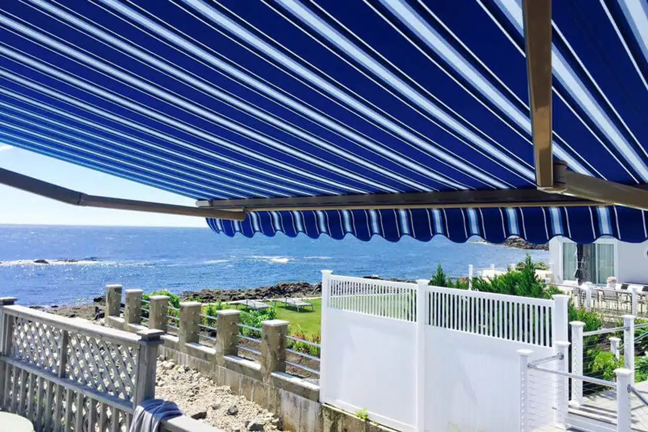 Eclipse retractable awning with ocean view creating covered outdoor living space