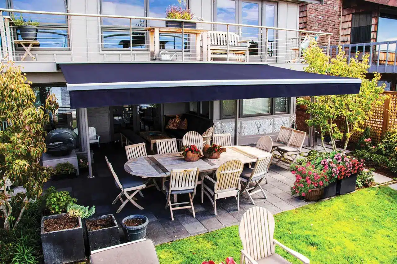 Retractable patio awning extended over deck providing UV protection and comfortable shade
