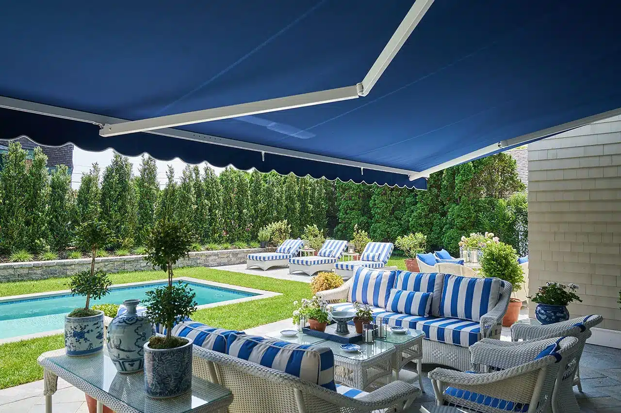 Professional awning installation on New Jersey home featuring motorized retractable design