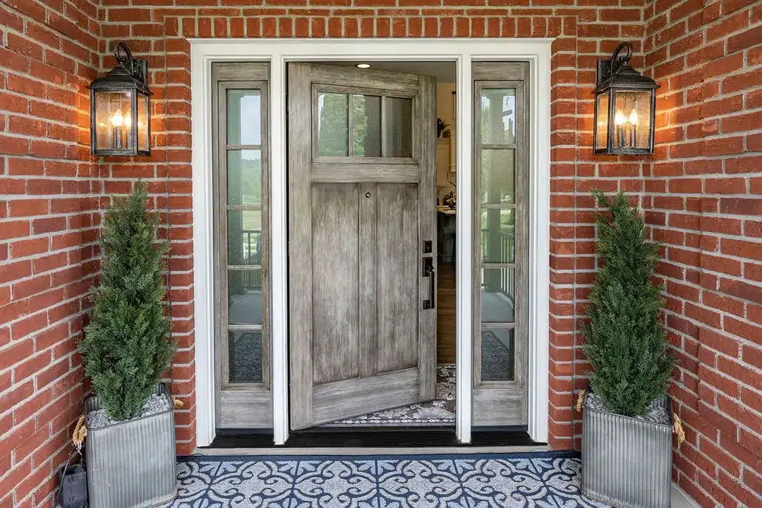 Signet 420DS entry door in natural leather finish with decorative glass panels