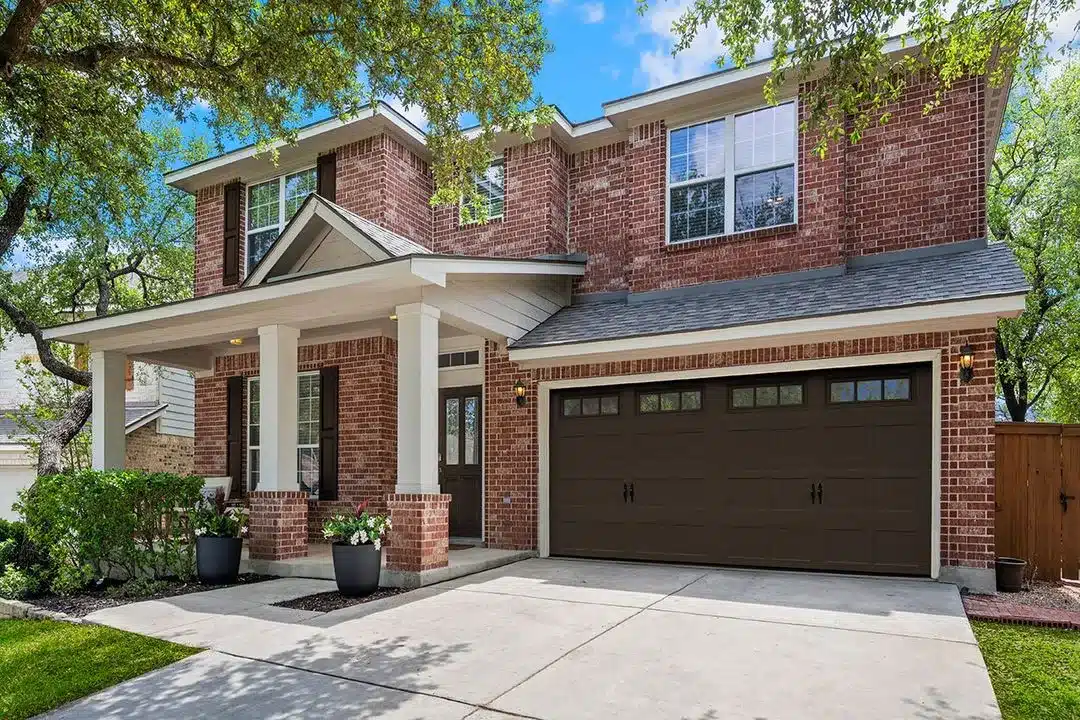 Espresso finish garage door installation showcasing rich dark brown color and classic design
