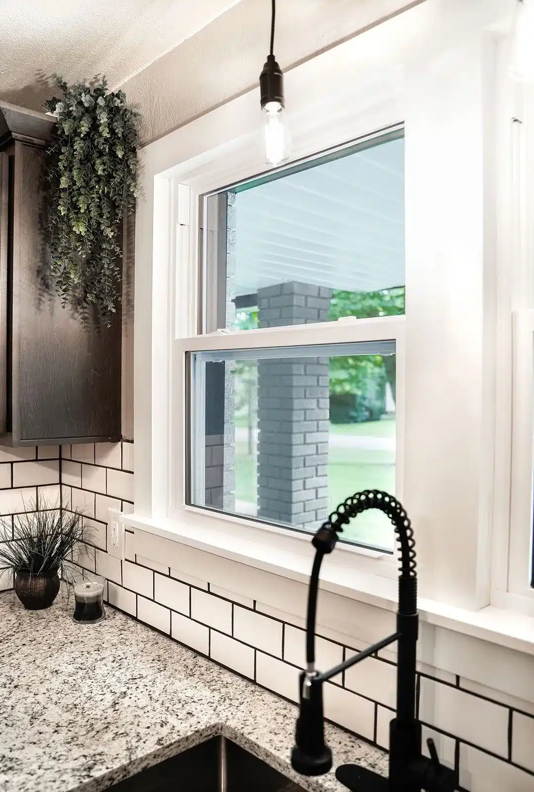 White Ecolite single-hung window featuring energy-efficient design and clean lines