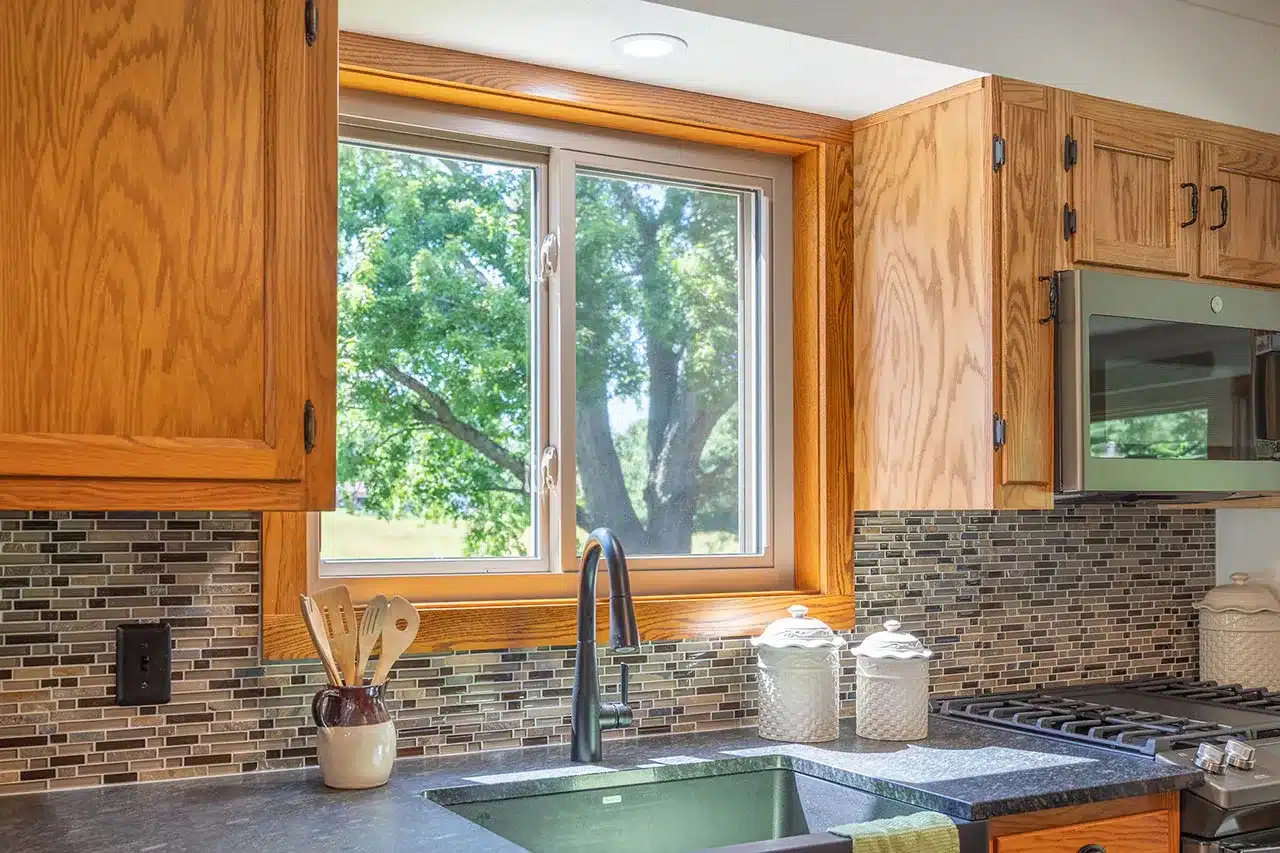 Aspect slider window in sandstone finish with panoramic outdoor views